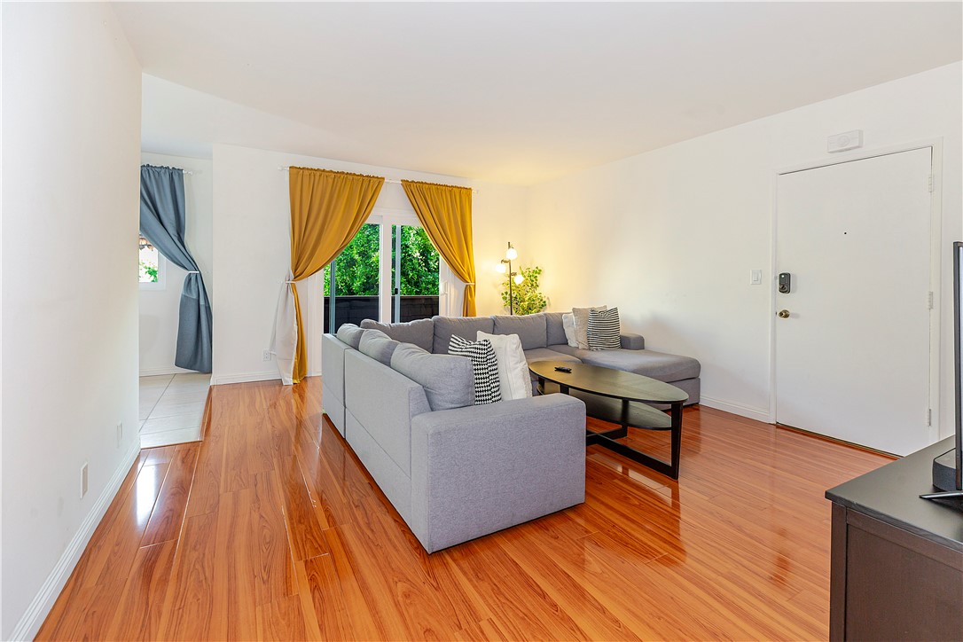 5400 Newcastle Avenue, Unit 70 Encino, CA 91316 - Photo 16 of 32 a living room with furniture and a large window