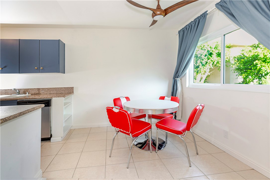 5400 Newcastle Avenue, Unit 70 Encino, CA 91316 - Photo 6 of 32 a view of a dining room with furniture a rug and wooden floor