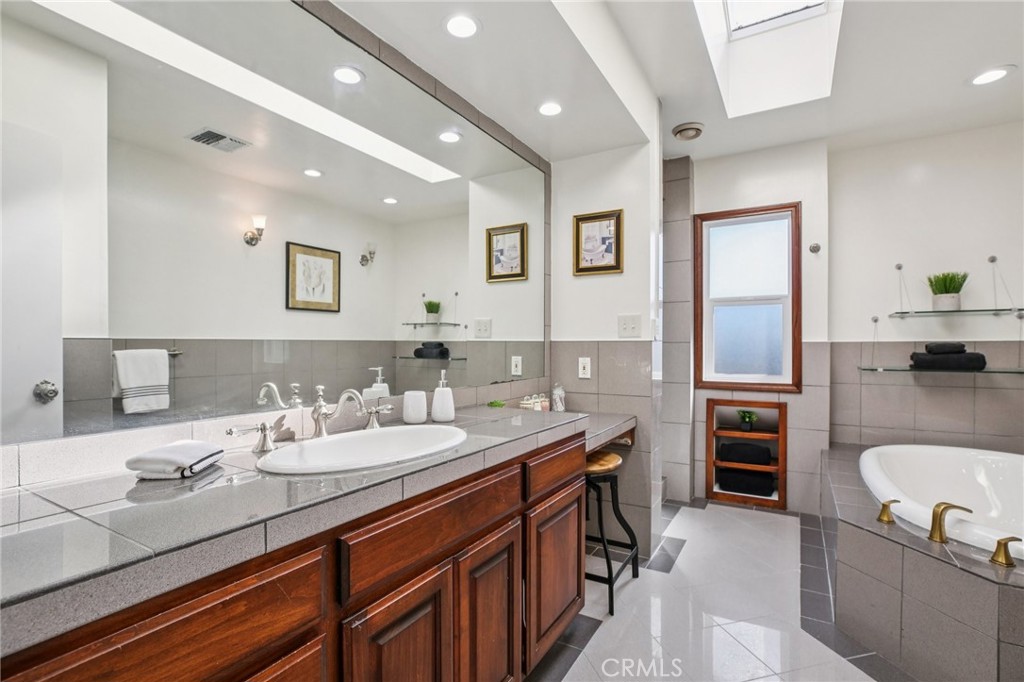 367 Ultimo Avenue Long Beach, CA 90814 - Photo 23 of 37 a bathroom with a granite countertop sink mirror and toilet
