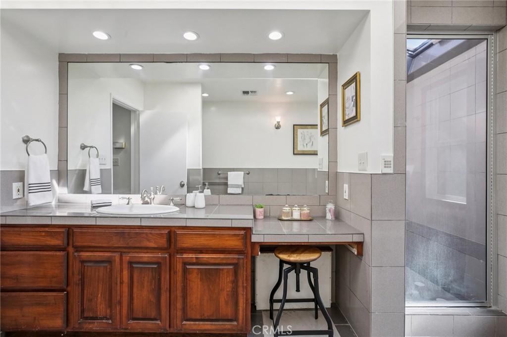 367 Ultimo Avenue Long Beach, CA 90814 - Photo 25 of 37 a bathroom with a double vanity sink and a mirror