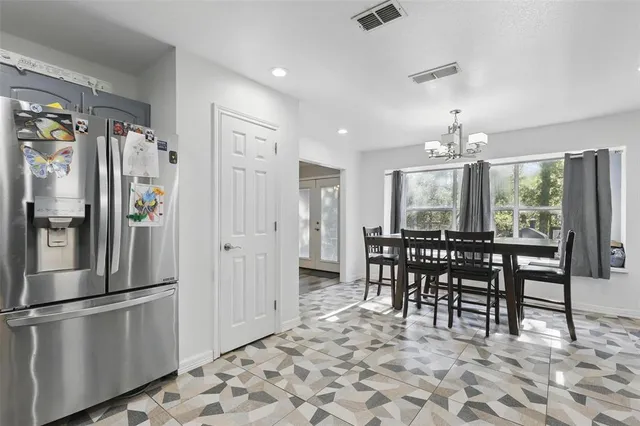 a view of a dining room with furniture window and outside view