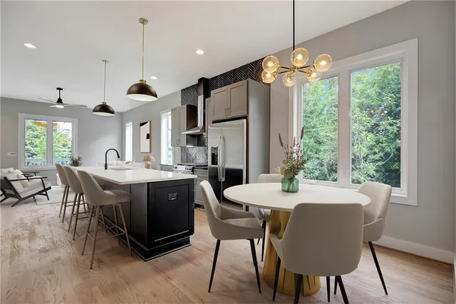 a view of a dining room with furniture window and wooden floor