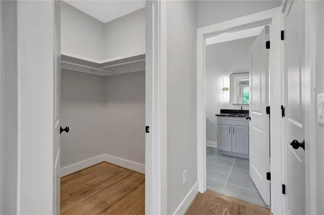 a bathroom with a granite countertop sink a toilet and a bathtub