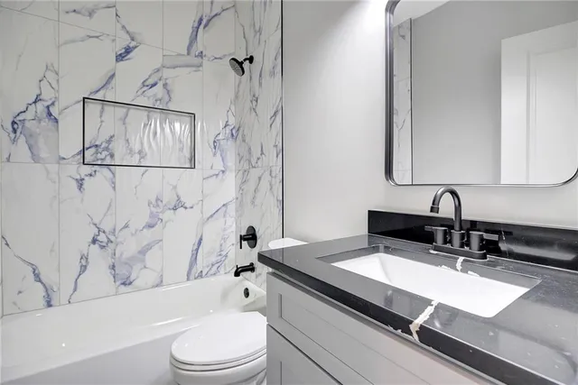 a bathroom with a sink and mirror