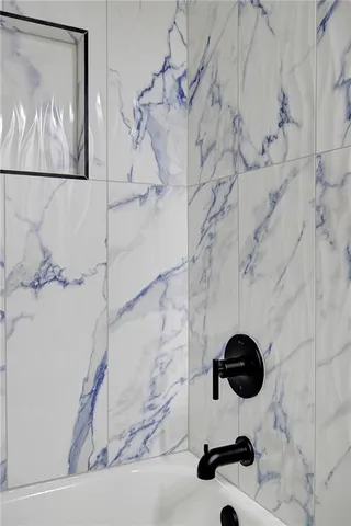 a view of a hallway with wooden floor and stairs