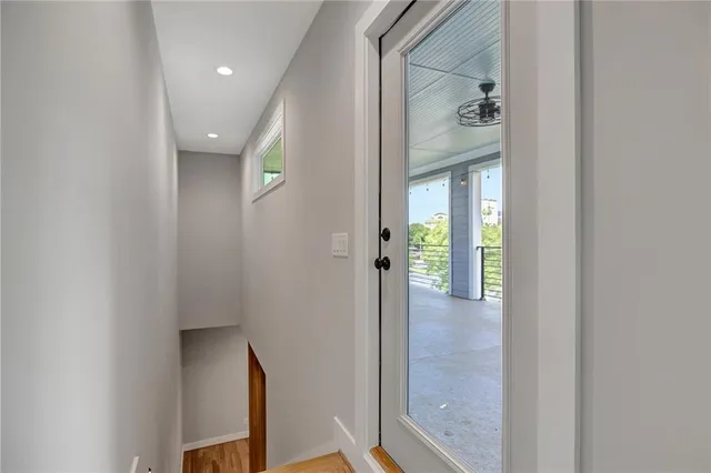 a view of a livingroom with furniture and floor to ceiling window