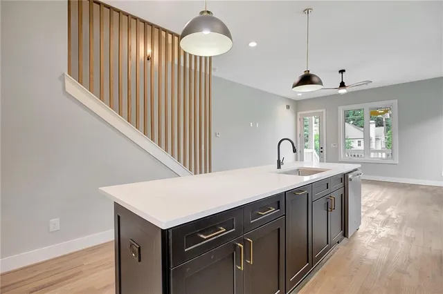 a kitchen with a stove and a sink