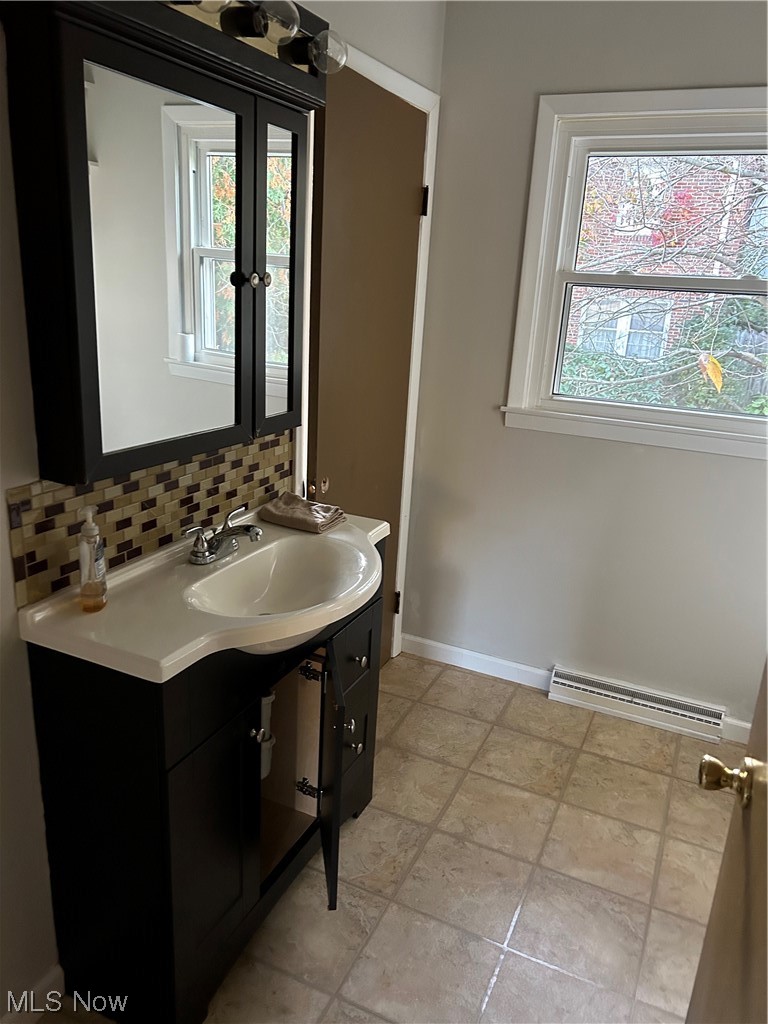 6229 Waterloo Road Atwater, OH 44201 - Photo 13 of 23 Bathroom with a backsplash, vanity, and tile floors