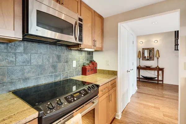 a kitchen with a stove and a microwave
