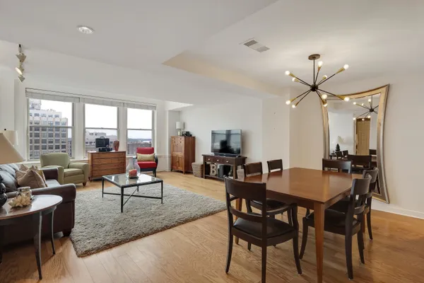 a view of a dining room with furniture window and outside view