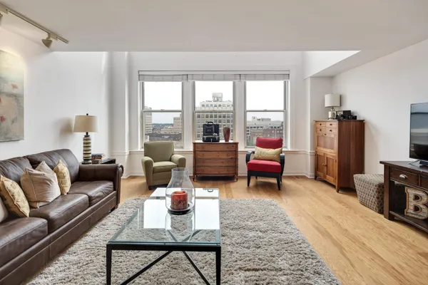 a living room with furniture and a large window