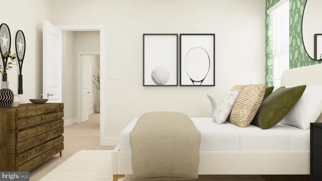 a bedroom with a bed and dresser