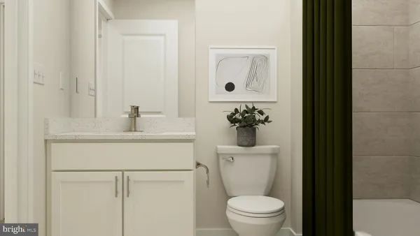 a bathroom with a sink toilet and a mirror