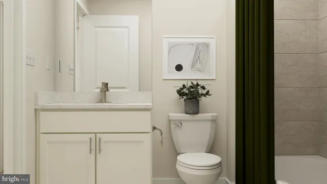 a bathroom with a sink toilet and a mirror