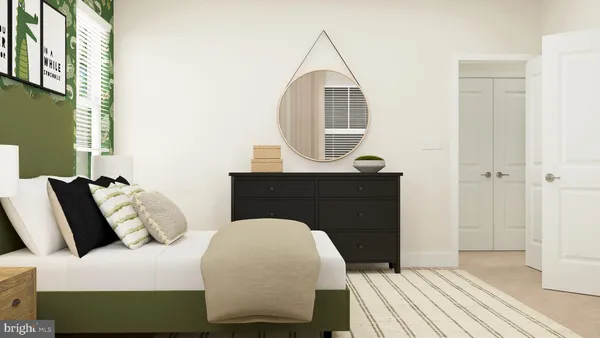 a bedroom with a bed a mirror and a window