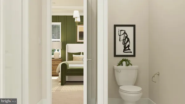 a bathroom with a toilet and a sink