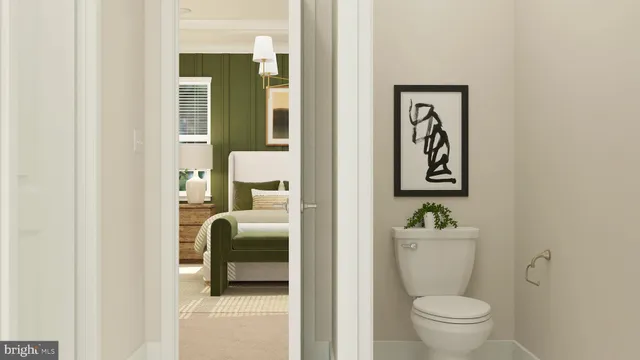 a bathroom with a toilet and a sink