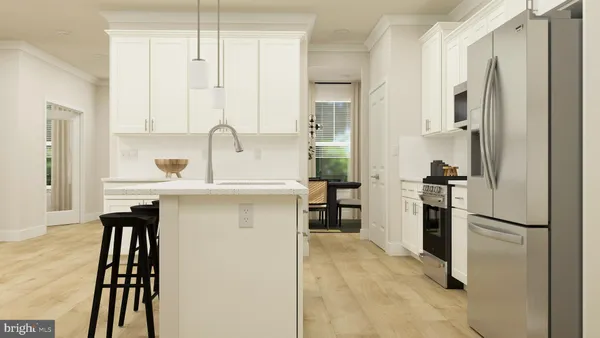 a kitchen with stainless steel appliances a refrigerator sink and stove