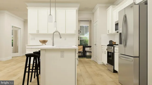 a kitchen with stainless steel appliances a refrigerator sink and stove