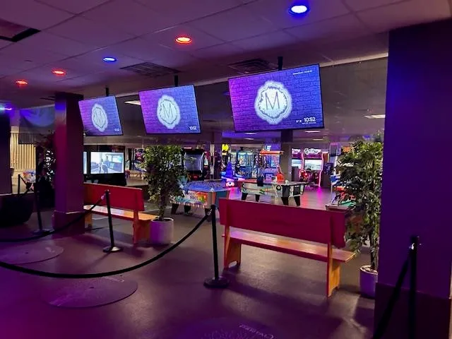 a view of a cafe with table and chairs