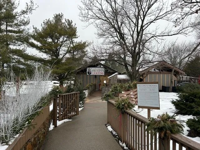 a view of a house with wooden fence