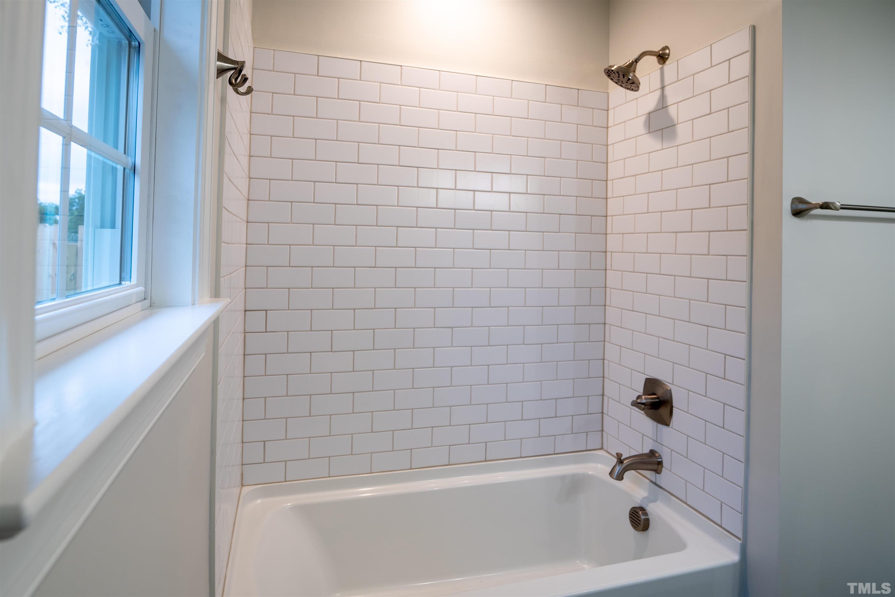 910 South East Street Raleigh, NC 27601 - Photo 10 of 17 a bathroom with a bathtub