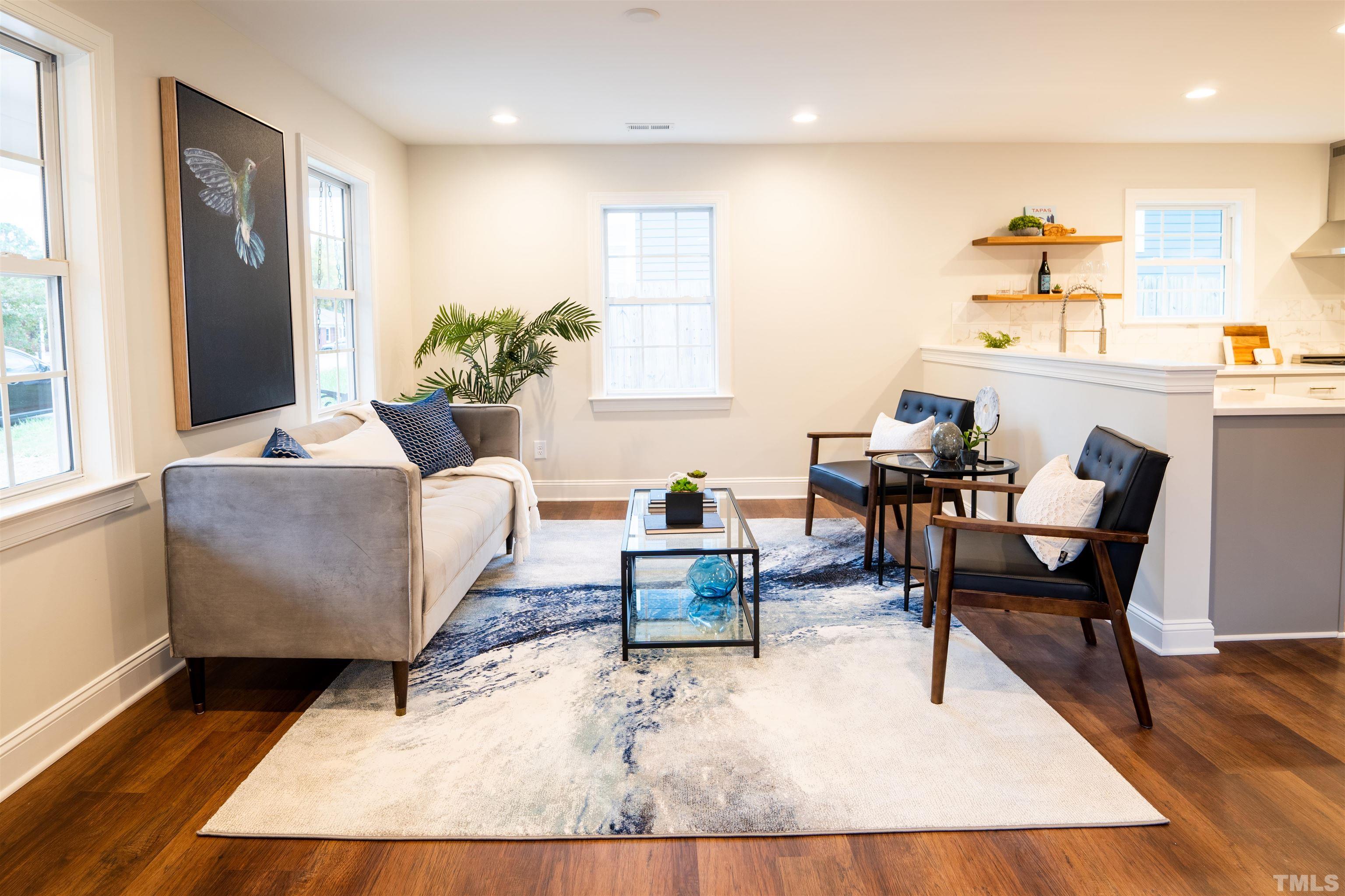 910 South East Street Raleigh, NC 27601 - Photo 14 of 17 a living room with furniture and wooden floor
