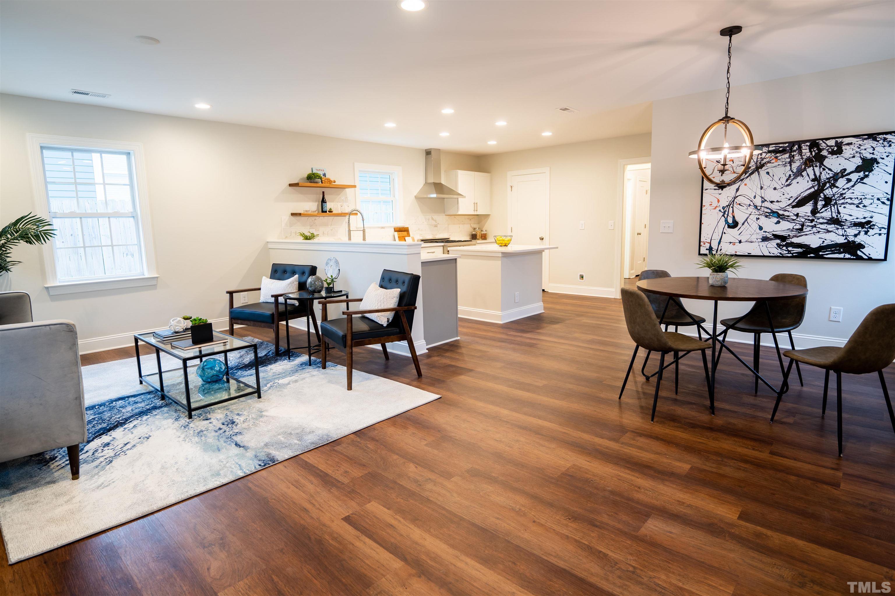 910 South East Street Raleigh, NC 27601 - Photo 15 of 17 a living room with furniture dining table and wooden floor