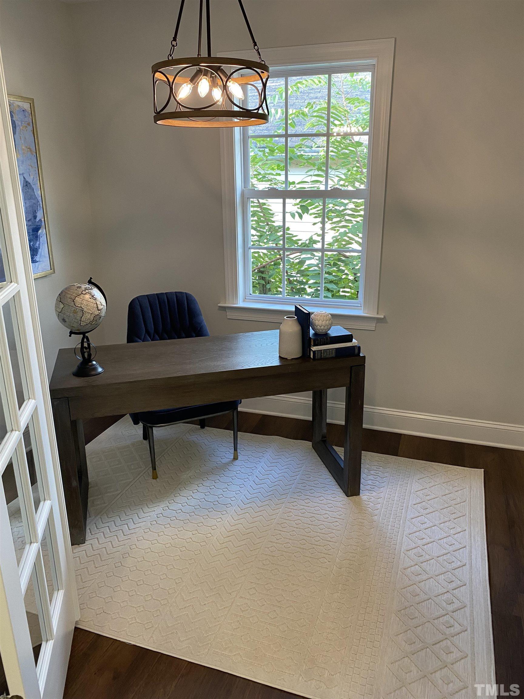 910 South East Street Raleigh, NC 27601 - Photo 3 of 17 a view of a livingroom with furniture and a window