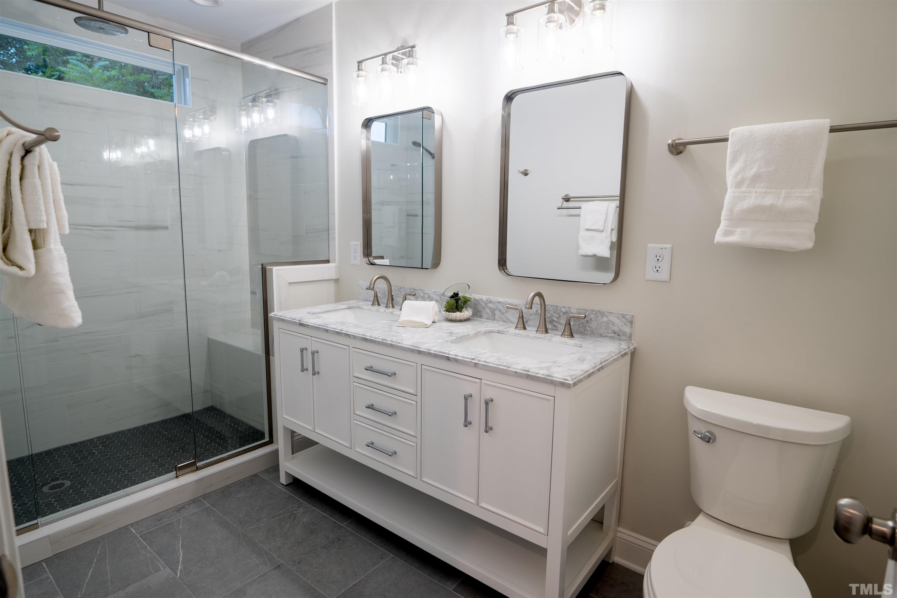 910 South East Street Raleigh, NC 27601 - Photo 5 of 17 a bathroom with a granite countertop sink mirror and toilet