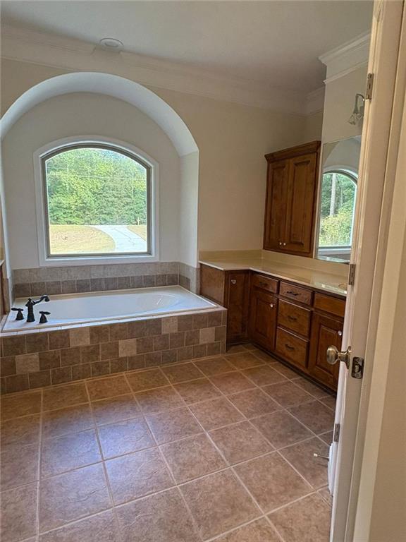 1487 Mt Zion Road Oxford, GA 30054 - Photo 12 of 18 a bathroom with a tub sink and window