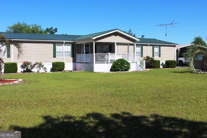 3538 Buck Head Road Baxley, GA 31513 - Photo 1 of 1 a view of a house with yard and green space