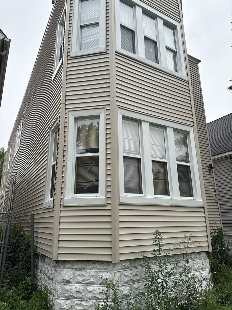 310 West 105th Street Chicago, IL 60628 - Photo 2 of 22 a view of a house with white door