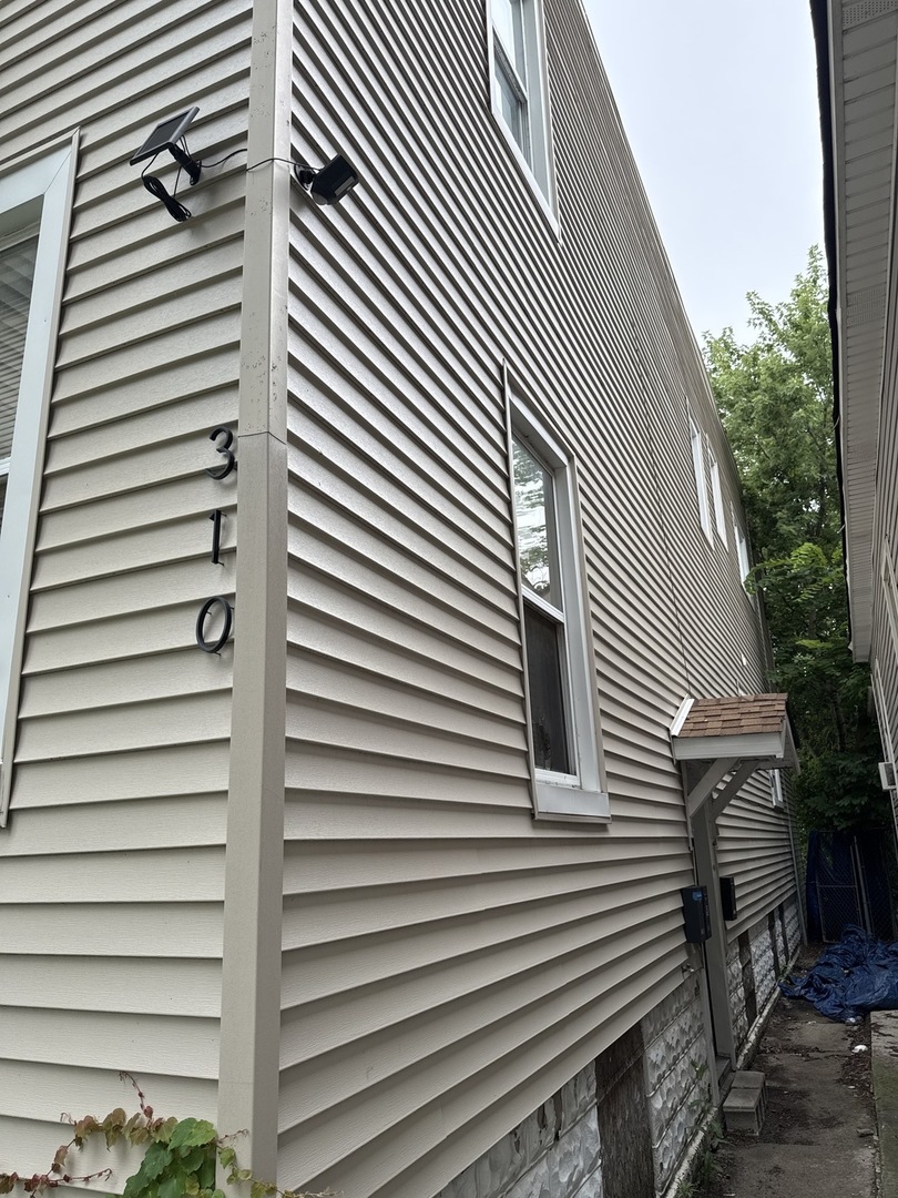 310 West 105th Street Chicago, IL 60628 - Photo 3 of 22 a view of a back side of house