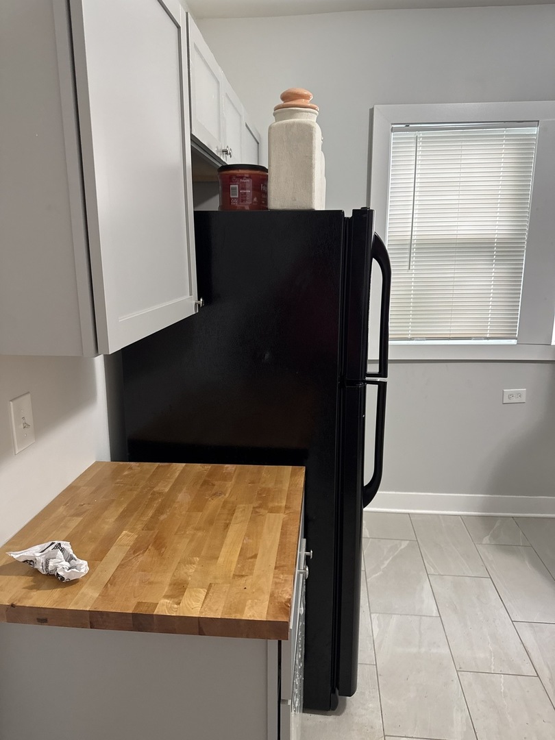 310 West 105th Street Chicago, IL 60628 - Photo 10 of 22 a bathroom with a bathtub