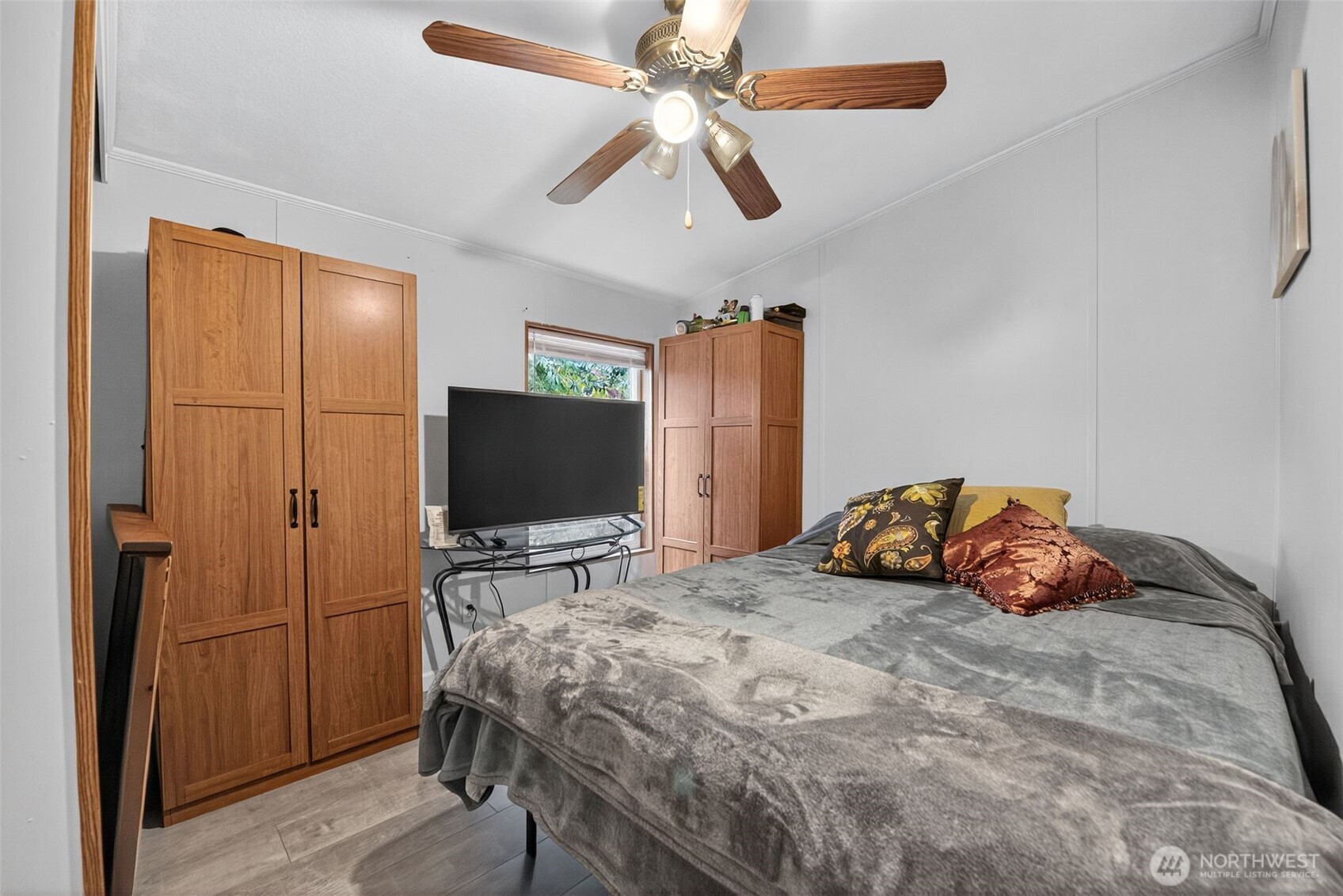 19941 Rhododendron Drive East Bonney Lake, WA 98391 - Photo 11 of 16 a bedroom with a bed and a flat screen tv