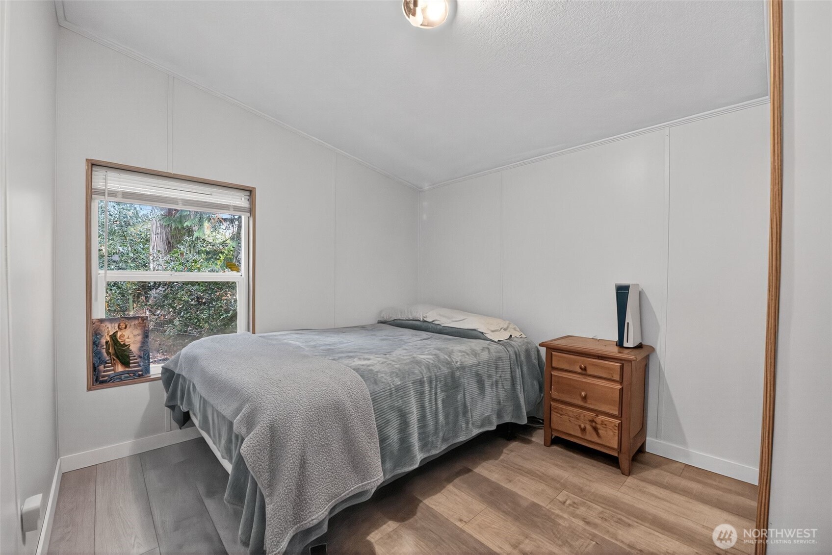 19941 Rhododendron Drive East Bonney Lake, WA 98391 - Photo 12 of 16 a bedroom with a bed and a window