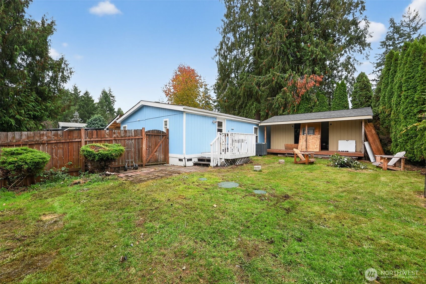 19941 Rhododendron Drive East Bonney Lake, WA 98391 - Photo 15 of 16 a view of a house with backyard and garden