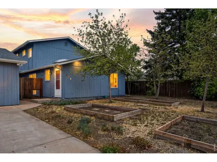 a house view with a backyard space