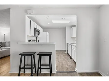a kitchen with a refrigerator stove and microwave