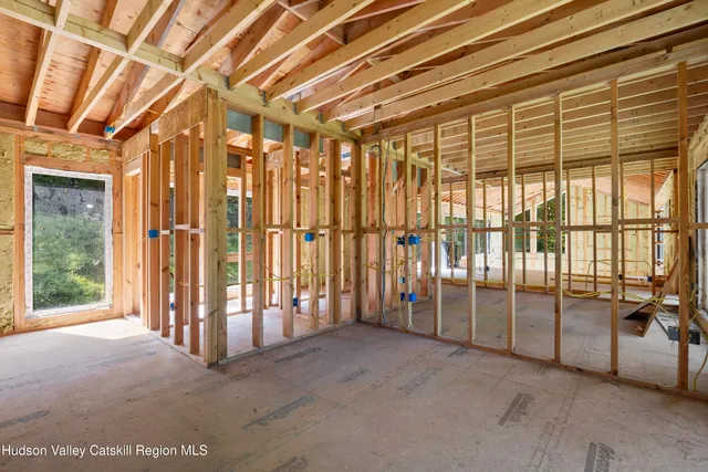 a living room with furniture and a lamp