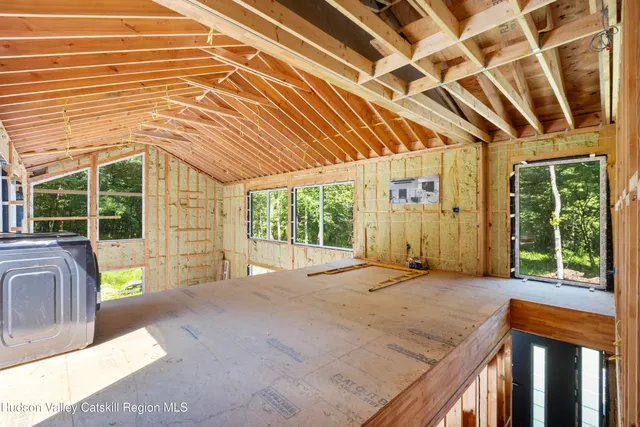 a living room with furniture and a bathtub