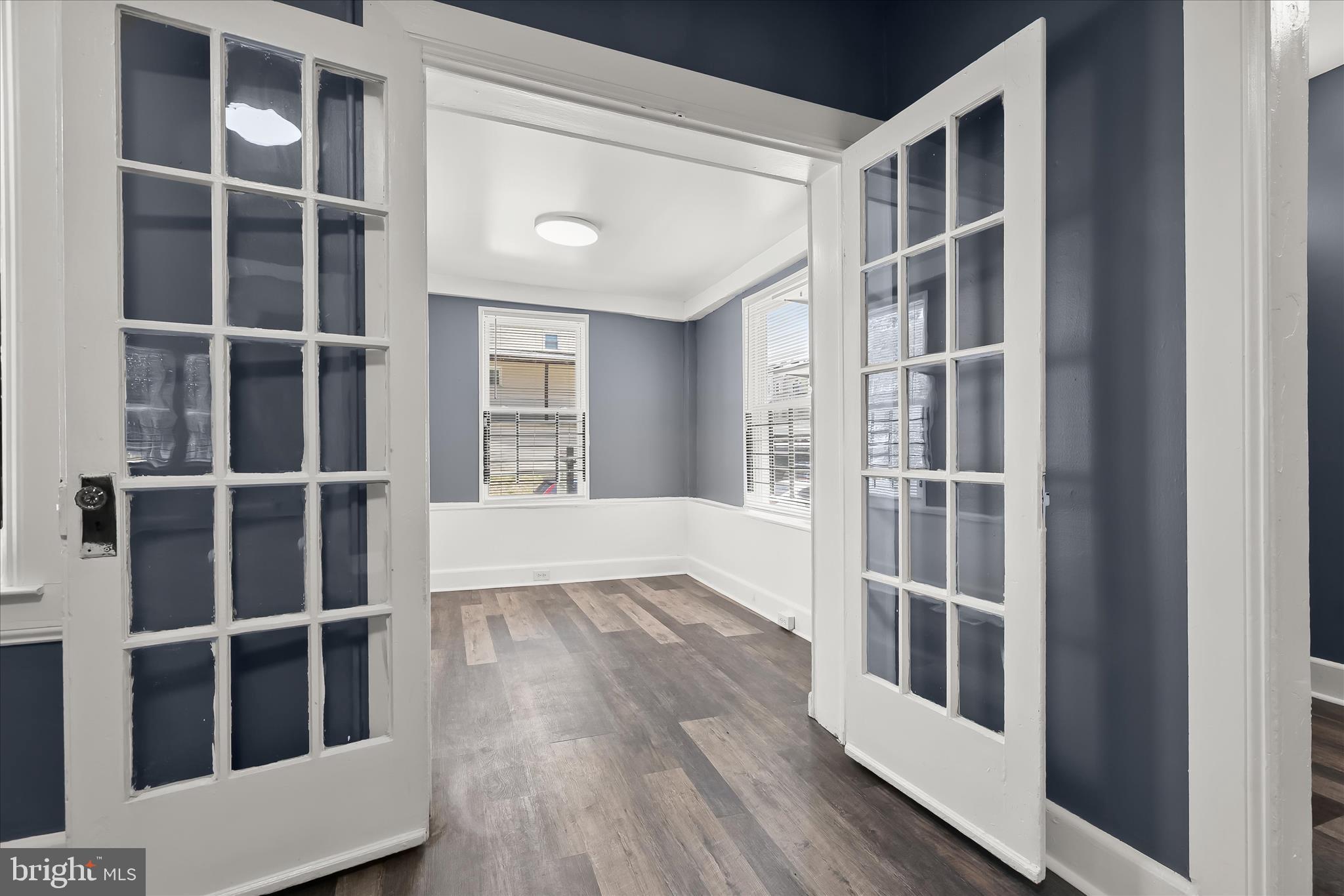 3534 Overview Road Baltimore, MD 21215 - Photo 9 of 28 a view of wooden floor and windows in a room