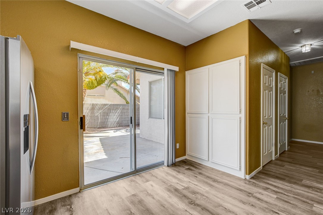 286 Manzanita Ranch Lane Henderson, NV 89012 - Photo 13 of 50 Kitchen and Sliding Doors to Back Yard