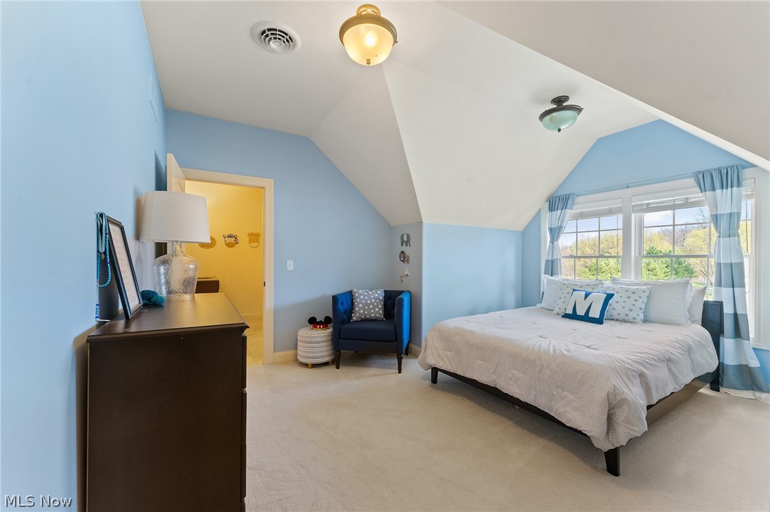 6716 Kyle Ridge Pointe Canfield, OH 44406 - Photo 25 of 43 Bedroom featuring vaulted ceiling and light carpet