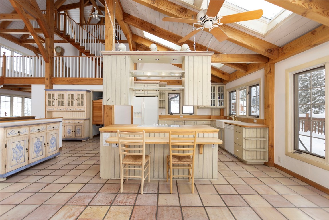 300 Gold Hill Road Breckenridge, CO 80424 - Photo 20 of 50 a kitchen with cabinets and chairs