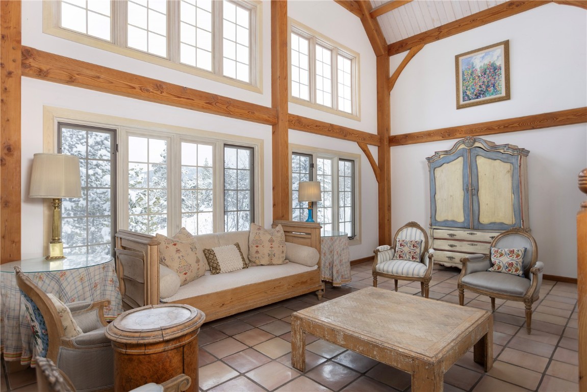 300 Gold Hill Road Breckenridge, CO 80424 - Photo 22 of 50 a living room with furniture and a large window
