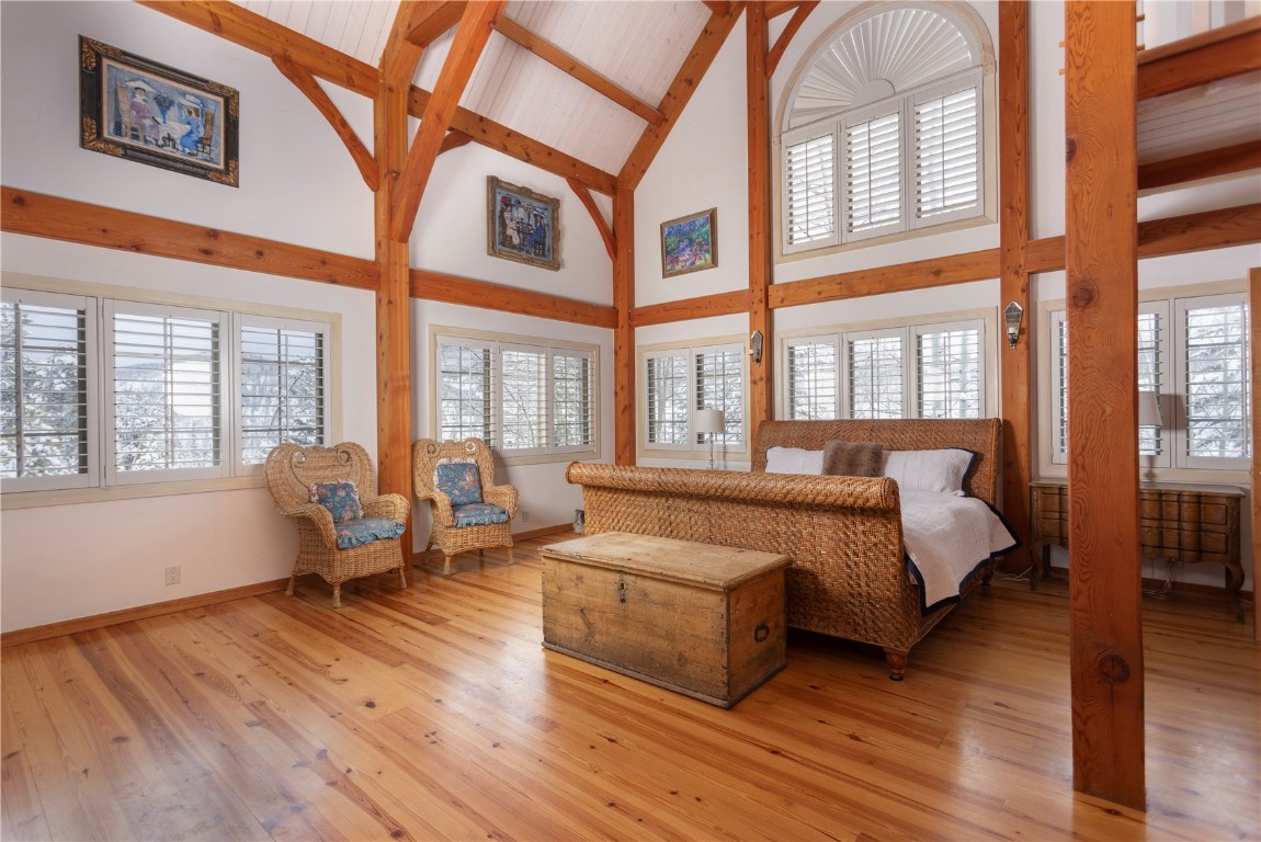 300 Gold Hill Road Breckenridge, CO 80424 - Photo 24 of 50 a spacious bedroom with a large bed and a large window