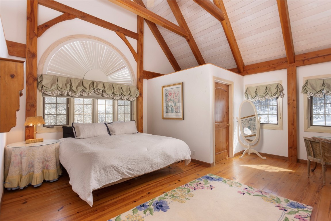 300 Gold Hill Road Breckenridge, CO 80424 - Photo 28 of 50 a bedroom with a bed and a large window