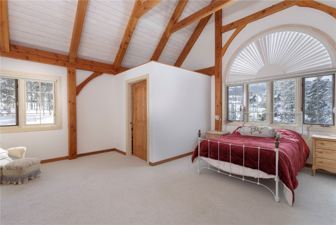 300 Gold Hill Road Breckenridge, CO 80424 - Photo 29 of 50 a bed room with a bed and a large window